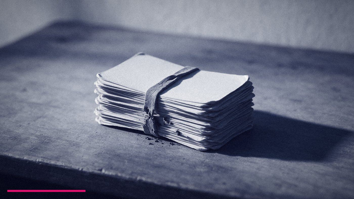 Fractional Cmo Training: What It Covers And What It Misses 5 A Thick Worn Stack Of Blank Business Cards Bound With A Perished Rubber Band On A Bare Desk, Standing For Referral As The Main Source Of Fractional Work