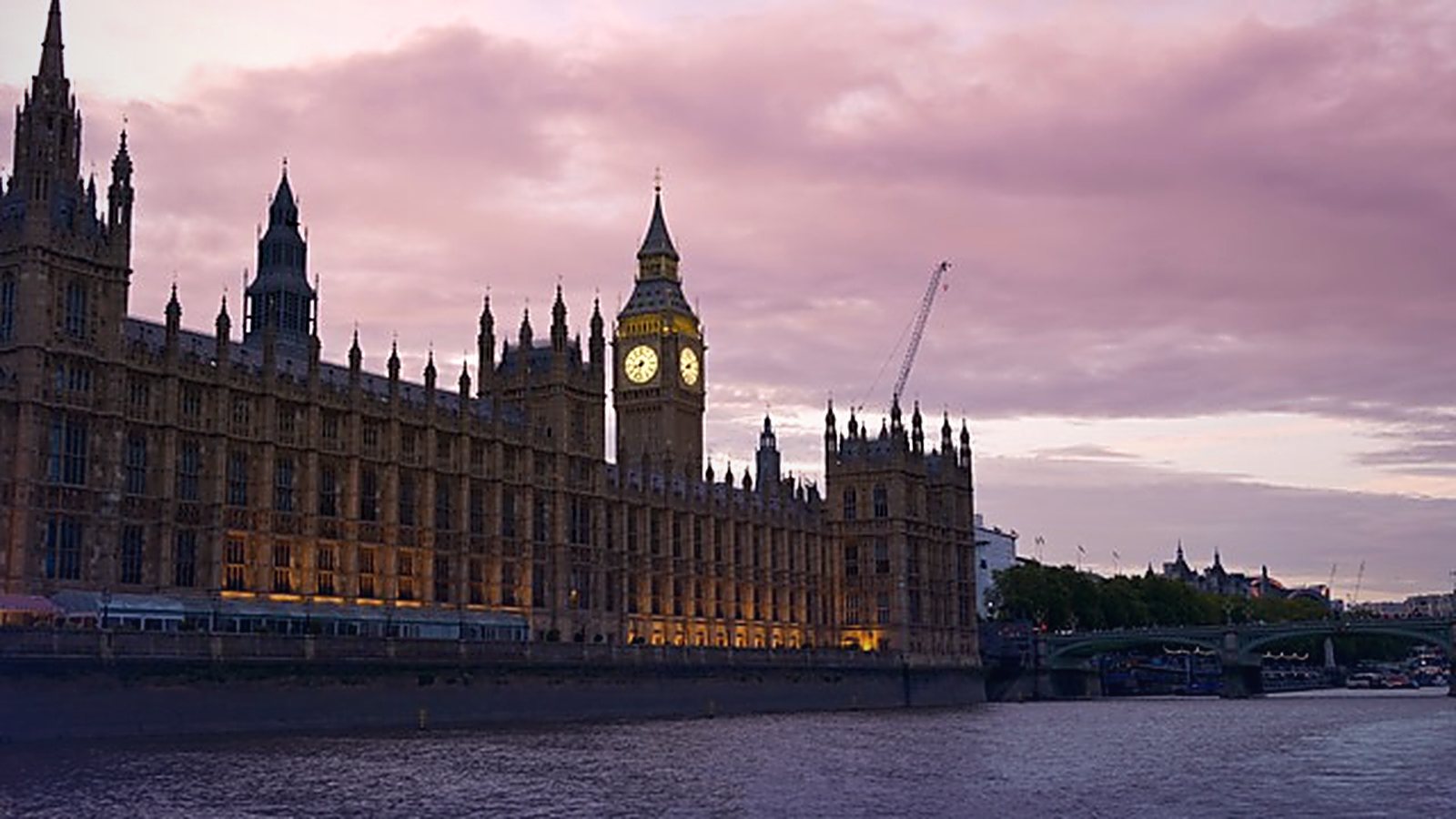 The Palace Of Westminster At Dusk, Where The Uk Published Six Sector Ai Adoption Plans In June 2026.